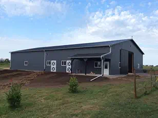 Horse barn with a porch over the entry doors