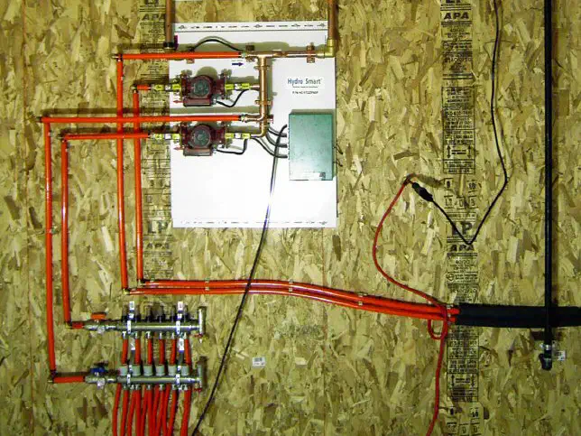 Boiler and in-floor heat piping on a plywood panel