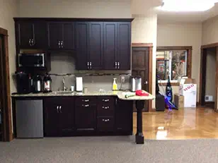 Office break room with dark cabinets