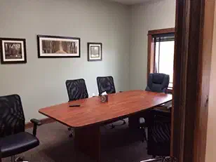 Conference room with a long wood table