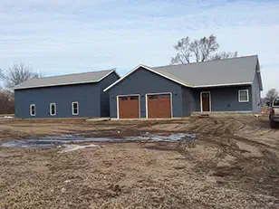 Front of a finished new home with two garage doors