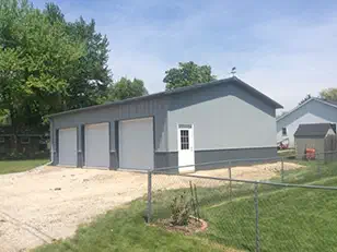 Gray three-stall steel garage